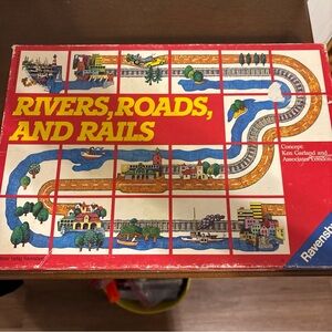 Ravensburger Rivers, Roads, and Rails Board Game - Red, Blue, Yellow